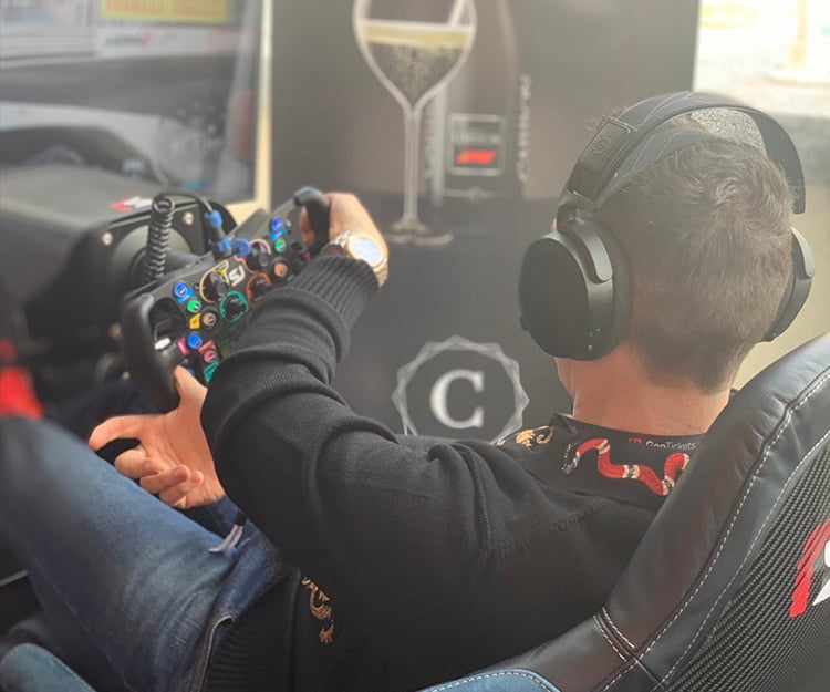 A man sitting on a sim racing rig