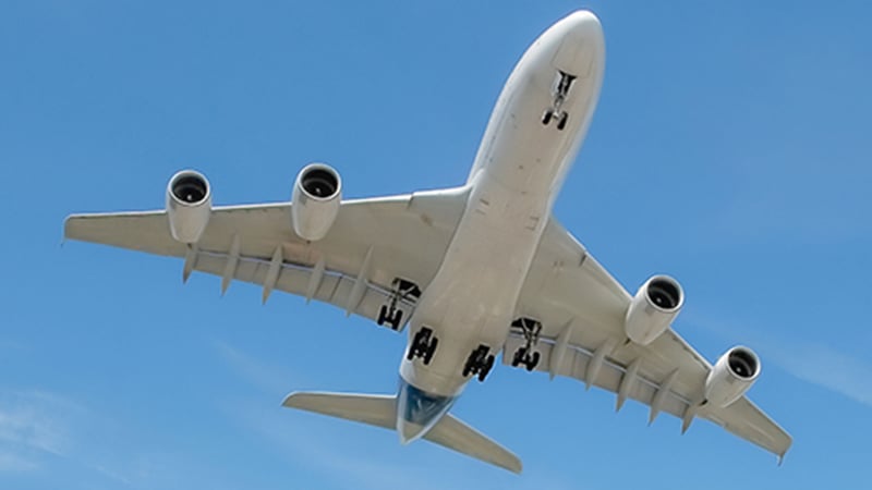 An airplane flying through the sky