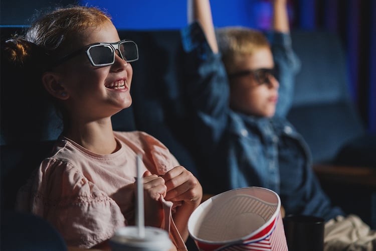 Kids watching a movie in 3D