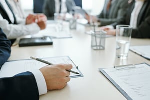 A board of directors sits around a table